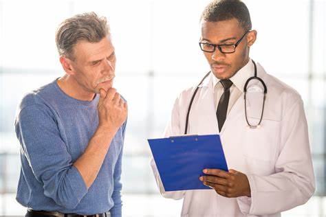 A doctor and patient looking at a clipboard